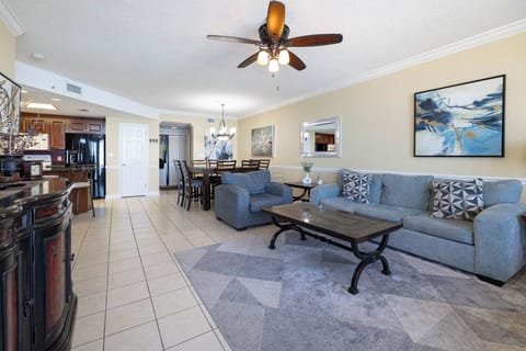 Unwind in the spacious living area with comfortable seating, a stylish coffee table, and a welcoming atmosphere