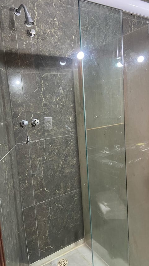 Standard Double Room Single Use | Bathroom | Shower, towels, soap, toilet paper