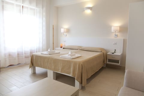 Family Quadruple Room, Ensuite, Ground Floor | Memory foam beds, in-room safe, desk, laptop workspace
