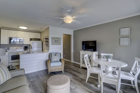 Living/Dining/Kitchen - This beautifully decorated Oceanfront villa has been totally renovated.
The dining table has seating for four.
The Living Room has designer furnishings and new wood grain tile flooring.