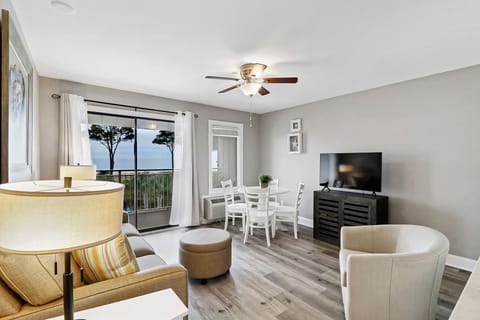 Living room with an oceanfront view. - Spectacular oceanfront view from living room. Sip on a cup of coffee while enjoying the sunrise each morning during your stay.