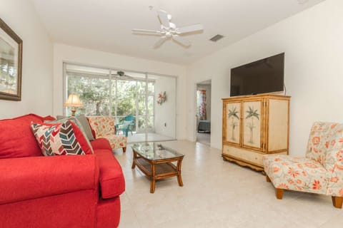 The sliding glass door across the back of the condo allows for a full view of the nature preserve, while you realx and enjoy the large screen Smart TV