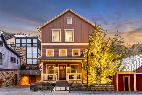 Stunning alpenglow on The Peak at Town Lift, a private home, decorated in timeless white holiday lights.