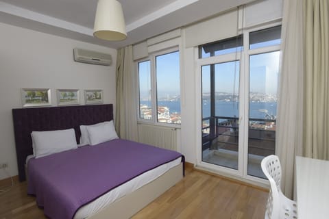 Apartment, 2 Bedrooms, Balcony, Sea View | In-room safe, individually decorated, individually furnished, desk