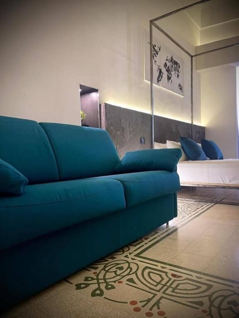 Junior Suite, Balcony, Sea View | Minibar, in-room safe, desk, iron/ironing board