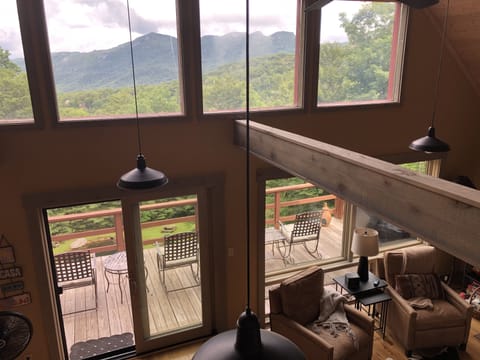 Gaze out over the mountain through the window wall in the living room