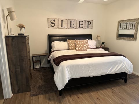 Primary Bedroom - King Bed w/ TV