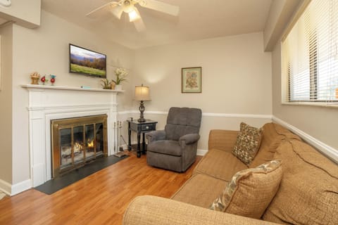 Curl up in your cozy living room where a warm fireplace and plush seating invite you to relax after a day of exploring.