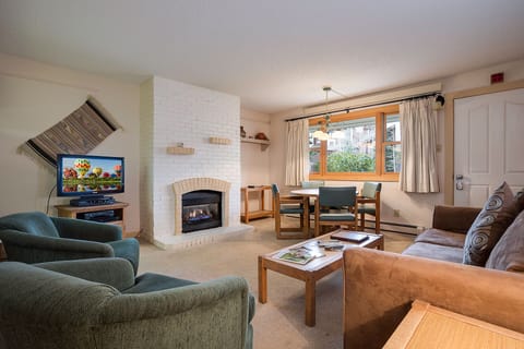 Cozy up by your private fireplace while watching TV, then gather around the dining table for memorable meals together.