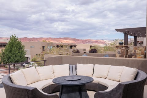 Front Patio Deck View & Firepit - Stay warm next to the firepit and relax while watching the sunset over the red mountains.