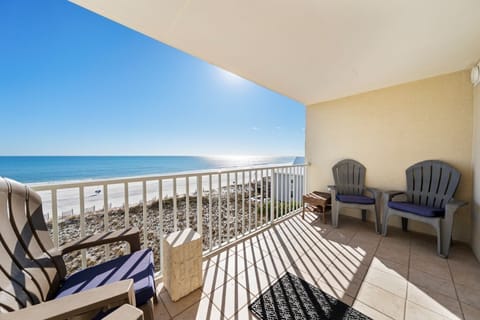 Relax on your private balcony with sweeping ocean views. Sink into comfortable seating while endless blue waters stretch before you—pure coastal bliss.