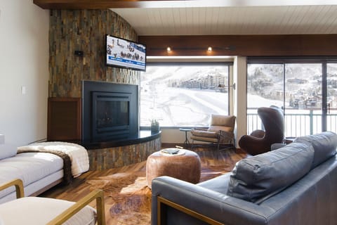 Sink into plush seating by the fireplace while you watch the snow-covered slopes from your panoramic windows.