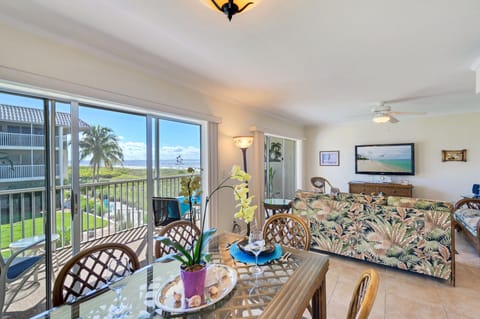 Living/dining room with access to screened lanai