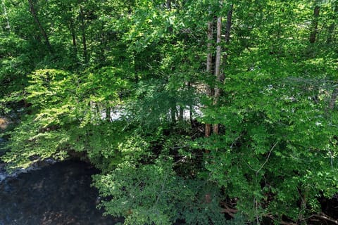 Large private balcony overlooking the river.