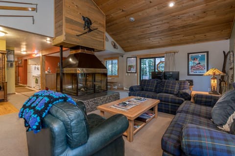 Living Room with four sided Glass Fireplace with Gas Log Lighter