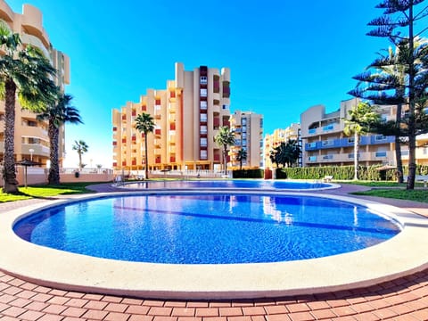 Spacious La Manga apartment balcony overlooking the marina, Mediterranean Sea, and Mar Menor lagoon.