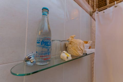 Deluxe Room, Beach View, Beachfront | Bathroom amenities | Shower, eco-friendly toiletries, towels