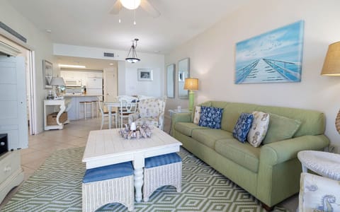 Relax on the comfortable sofa with queen sleeper, coastal décor, and enjoy the inviting vibe of the living space