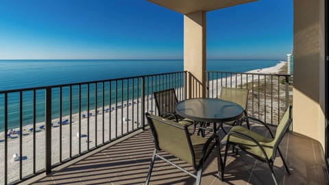 Enjoy meals or drinks at the outdoor table while taking in the tranquil beach views from your balcony