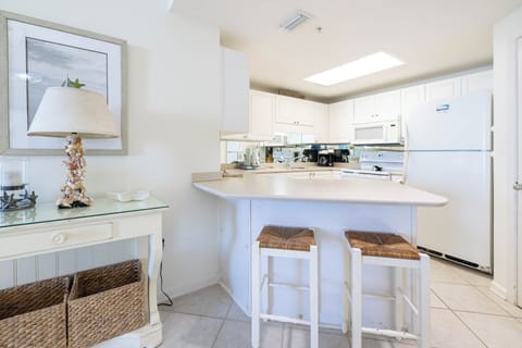 Prepare meals and enjoy morning coffee at the kitchen bar, featuring stylish stools and coffee maker with Keurig addition