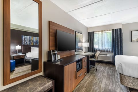 Premium bedding, desk, laptop workspace, iron/ironing board
