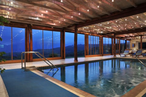 Indoor pool, outdoor pool, open 8 AM to 5 PM, pool umbrellas