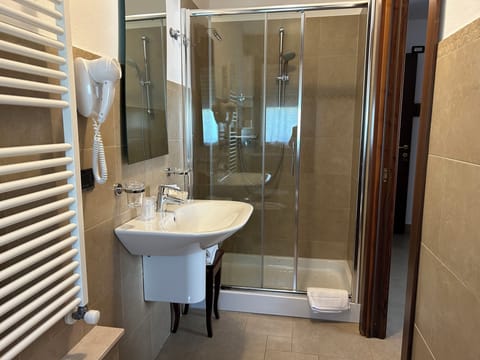 Basic Room, 1 Bedroom, Courtyard View | Bathroom | Shower, free toiletries, hair dryer, slippers