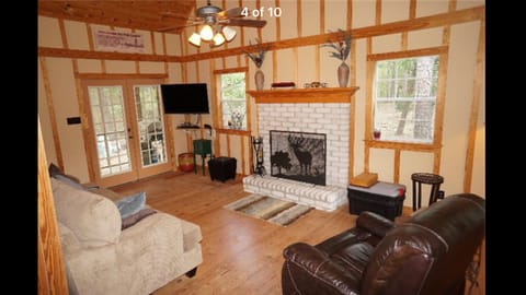 The living room with a fireplace to enjoy  TV/ cable , karaoke & Wi-Fi , games .