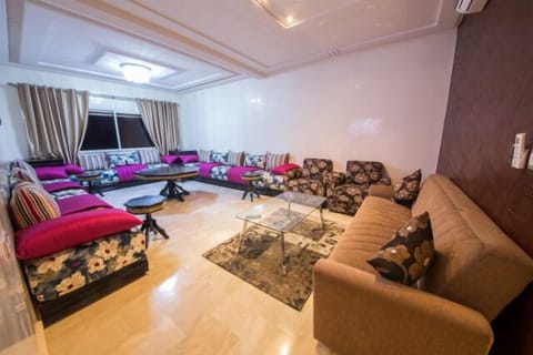 Apartment, 3 Bedrooms | Living room | Flat-screen TV