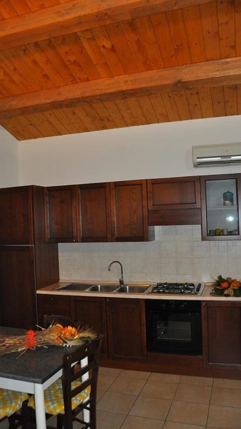 Apartment, 1 Bedroom (Gelso) | Private kitchen | Full-size fridge, oven, stovetop, coffee/tea maker
