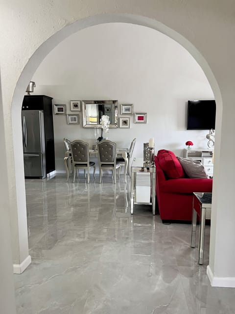 Arched entryway to the open concept living, dining and study areas. 