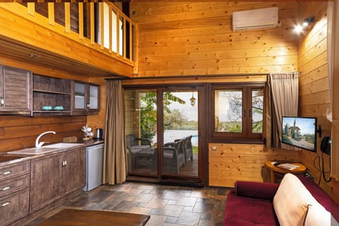 The Woodland Cottage - 2 Bedroom Villa with Sea View, Sauna & Shared Pool | Living room | Flat-screen TV