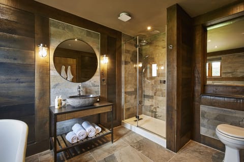 Shower, designer toiletries, hair dryer, towels