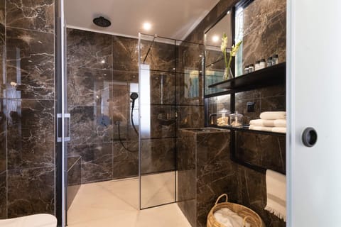 Shower, rainfall showerhead, designer toiletries, hair dryer