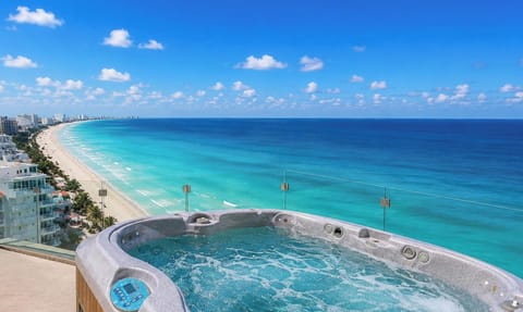 The Spacious Private Terrace Has a Great Ocean View, Table with Seating for 8, 2 Sunning Loungers &amp; a 4 person Hot Tub!