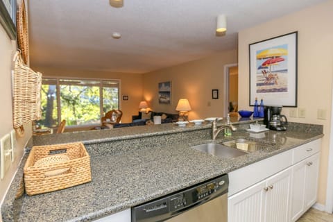 The open floor plan layout makes it very easy to interact with guests in the kitchen & living room areas.