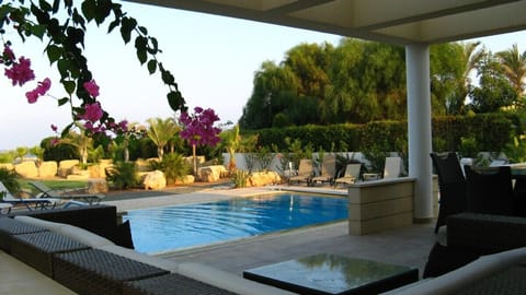 Seated patio beside private pool