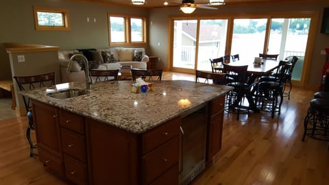 Additional sink, storage cabinets, and wine fridge make cooking meals a breeze