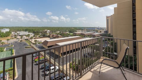 The master balcony offers a view of the surrounding greenery and nearby surroundings, perfect for enjoying the fresh air