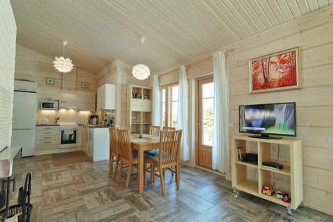 Family Villa, 2 Bedrooms, Sauna, Lakeside | Living area | 32-inch LED TV with digital channels, Smart TV, fireplace