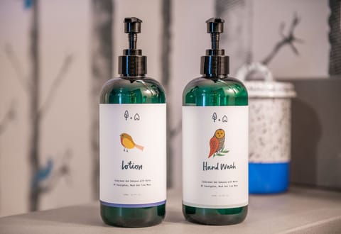 Designer toiletries, hair dryer, bathrobes, towels