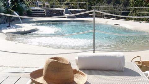 Seasonal outdoor pool, open 9:00 AM to 7:30 PM, pool umbrellas