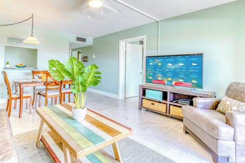 Relax in a bright and beachy living space with a cozy dining area