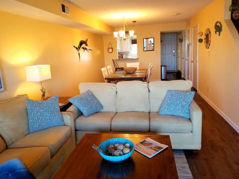 Den looking toward dining area and kitchen