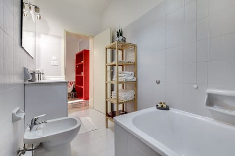 Apartment, 1 Bedroom | Bathroom | Combined shower/tub, deep soaking tub, rainfall showerhead, hair dryer