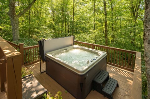 Celtic Cabin hot tub with wooded mountain views