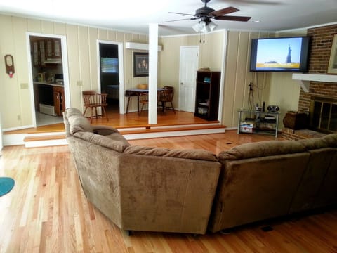 Spacious living room with 60" Flat Screen TV, extra large recliners.