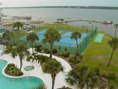 View from condo balcony of Gulf ShoresSurf and Racquet Club courtyard and lagoon