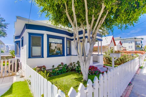 Admire the inviting front yard—a charming exterior that complements the warmth found within this Sherman Heights home.