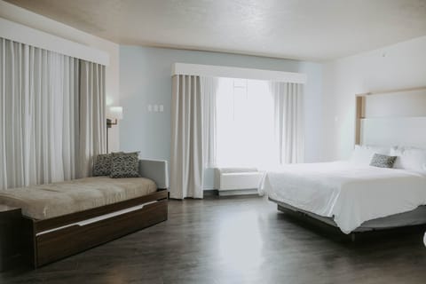 Suite, Multiple Beds (TDM Stadium View) | In-room safe, desk, iron/ironing board, free WiFi